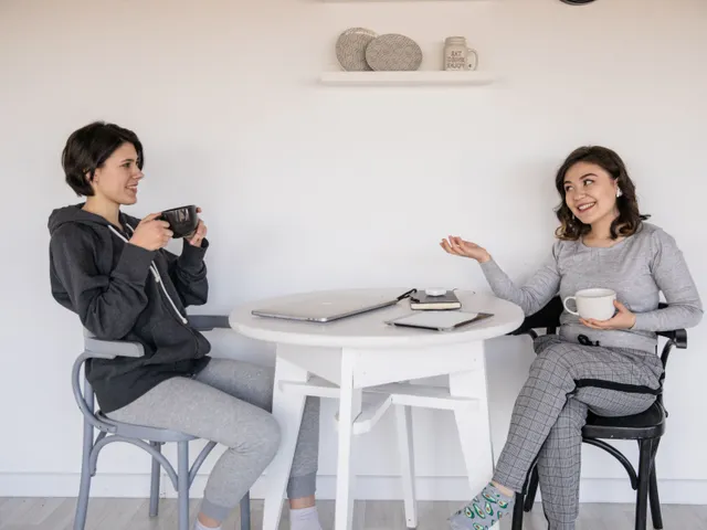 A family member and a support worker talking things through over coffee
